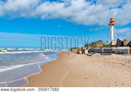Pape, Latvia - July 6 2020: Pape Lighthouse In Latvia Is A Lighthouse Located On The Latvian Coast O