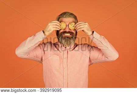 Obsessed With Pastry. Cookies On His Mind. Bearded Man Hold Cookies On Eyes. Yummy Delicious Treats.