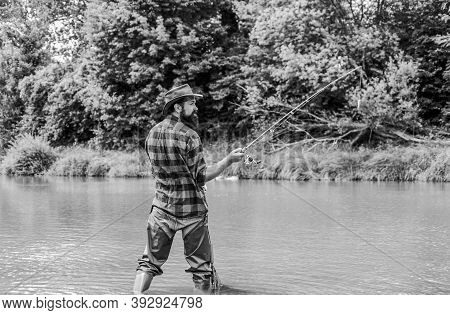 Keep Calm And Fish On. Mature Man Fly Fishing. Man Catching Fish. Fisherman With Fishing Rod. Hobby 