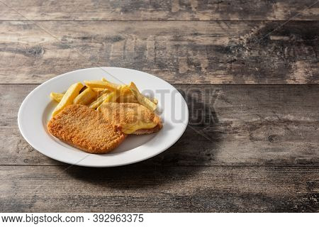 San Jacobo Steak Filled With Cheese And Ham On Wooden Table.copy Space