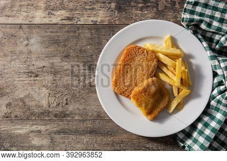 San Jacobo Steak Filled With Cheese And Ham On Wooden Table.top View. Copy Space