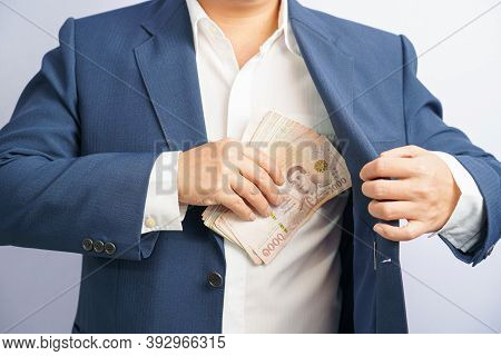 Money In Thailand Hold On Hand Business Man Grabbing Wearing A Blue Suit, Filed And Put And Give To 
