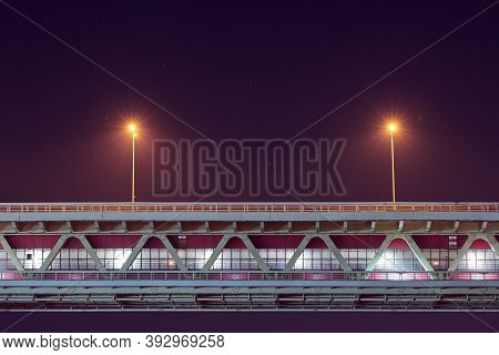 Night Rapid Transit Bridge Lighting. Minimalistic Light, Copy Space. Two Lamppost With Yellow Lighte