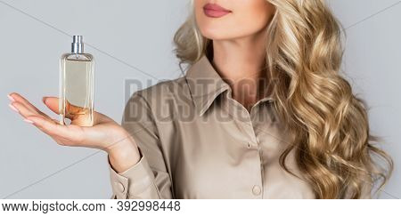 Woman With Bottle Of Perfume. Woman Presents Perfumes Fragrance. Beautiful Girl Using Perfume. Perfu