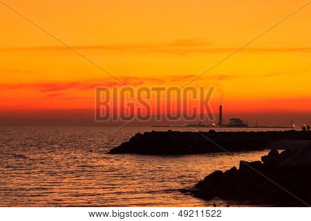 the beach in the evening with orange light