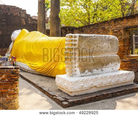 Lying Buddha Dressed In Yellow Scarf