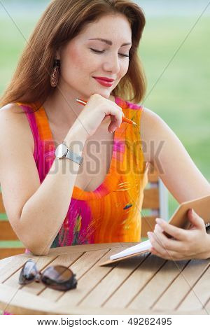 Young Lady Planning In Her Organizer
