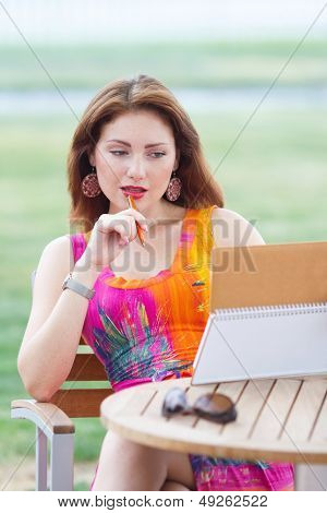 Young Lady Planning In Her Organizer