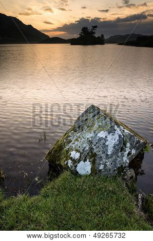 Stunning Mountain And Lake Sunrise Reflections Beautiful Landscape With Rock In Foreground