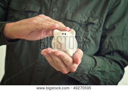 Piggy Coin Bank In Hands