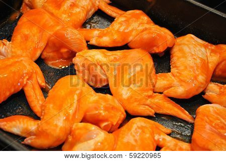 Saucy Raw Hot Wings in a Pan