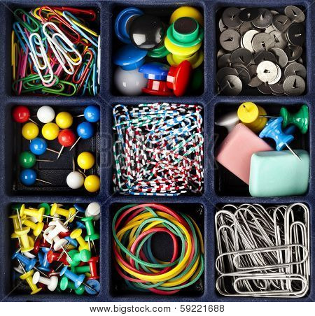collection of various stationery  in black box surface top view 