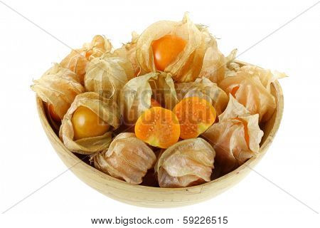Fresh Cape Gooseberry cut in half in a wooden bowl isolated on white