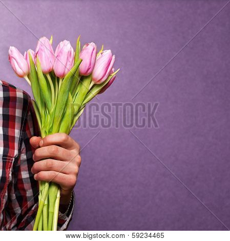 Man Holding A Bouquet Of Flowers