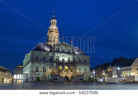 MAASTRICHT, NETHERLANDS - SEPTEMBER 7, 2013: Night view to town hall on the Market square of Maastricht,. The building was erected in the 17th century by Pieter Post