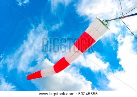 Blue Sky And Striped Windsock