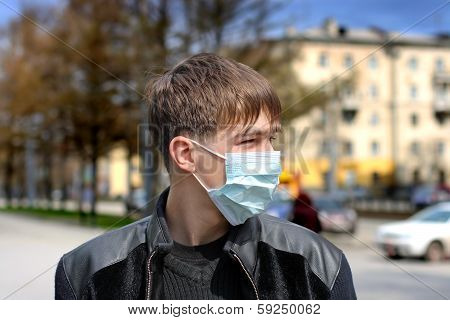 Teenager In Flu Mask