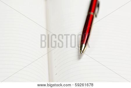 pen and open notepad