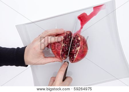 Man Or Chef Cutting A Pomegranate