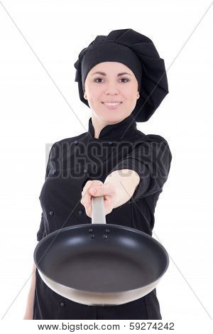 Young Cook Woman In Black Uniform With Teflon Frying Pan Isolated On White