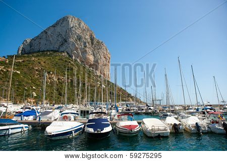Calpe Alicante marina boats with Penon de Ifach mountain in Mediterranean sea of Spain