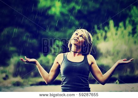 a pretty girl caught in a rain shower done with a vintage retro instagram filter