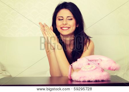 Young beautiful woman waiting for call