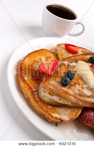 Stack Of Pancakes With Melted Butter , Slathered With Syrup And Coffee