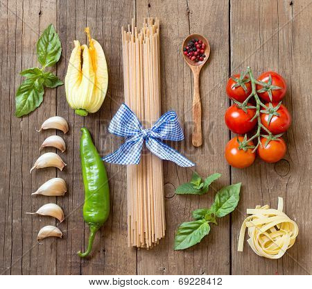 Pasta, Vegetables And Herbs On Wood