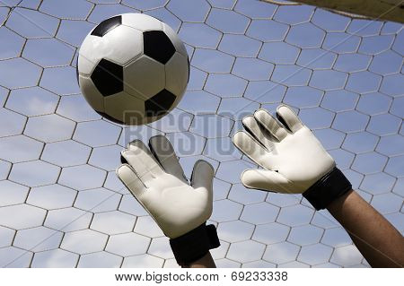 Goalkeeper's Hands Reaching Foot Ball