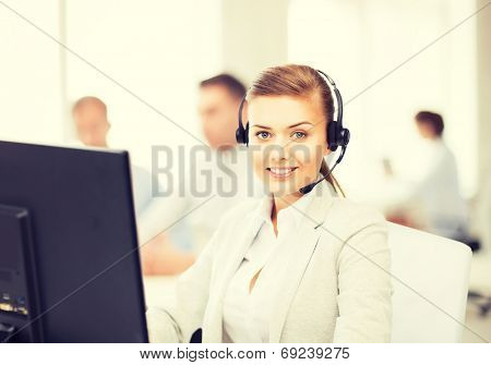 friendly female helpline operator with headphones in call centre