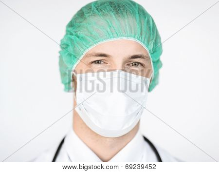 picture of half face of surgeon in medical cap and mask