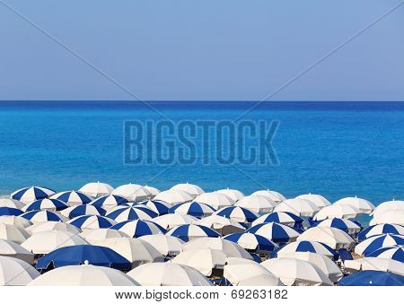 Tops of white and blue parasols Kathisma Lefkada Greece 