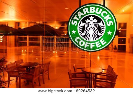 KUCHING - MAY 02: airport cafe interior on May 02, 2014 in Kuching, Malaysia. Starbucks is the largest coffeehouse company in the world, with 23,187 stores in 64 countries