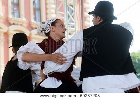 ZAGREB, CROATIA - JULY 19: Members of folk group Seljacka sloga from Donja Dubrava, Croatia during the 48th International Folklore Festival in center of Zagreb, Croatia on July 19, 2014
