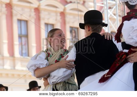 ZAGREB, CROATIA - JULY 19: Members of folk group Seljacka sloga from Donja Dubrava, Croatia during the 48th International Folklore Festival in center of Zagreb, Croatia on July 19, 2014