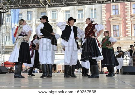 ZAGREB, CROATIA - JULY 19: Members of folk group Seljacka sloga from Donja Dubrava, Croatia during the 48th International Folklore Festival in center of Zagreb, Croatia on July 19, 2014