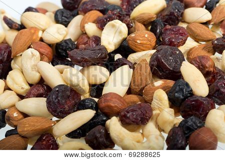 mixed nuts and dried fruits isolated on white background