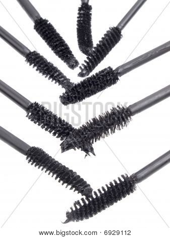 borstar för en mascara på en vit bakgrund