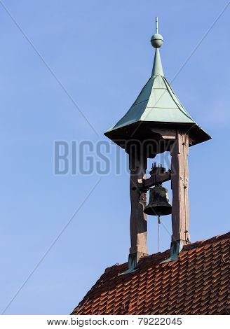 Single Old Church Bell Under Canopy On Roof
