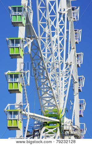 green noria booths with blue sky