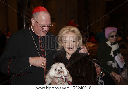 Cardinal Dolan with dog owner