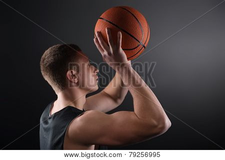 Caucasian male basketball player free throwing the ball