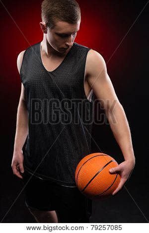 Caucasian basketball player holding the ball