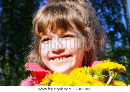 The happy girl with a bouquet