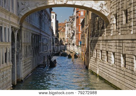 Gondola under the Bridge of sighs in Venice