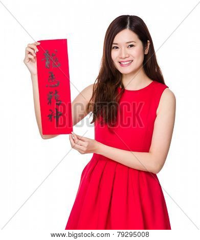Asian woman hold with china Fai Chun, phrase meaning is blessing for good health 