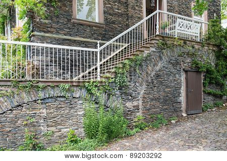 House With Brick Stone Facade And Stone Stairs