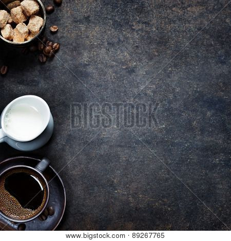 Top view of three different varieties of coffee beans on dark vintage background