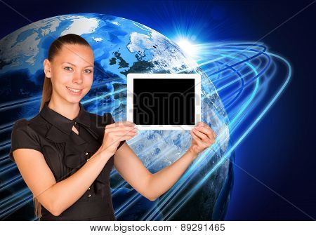 Young woman holging tablet on earth background